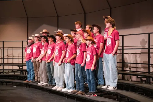Tenor bass choir singing with cowboy hats